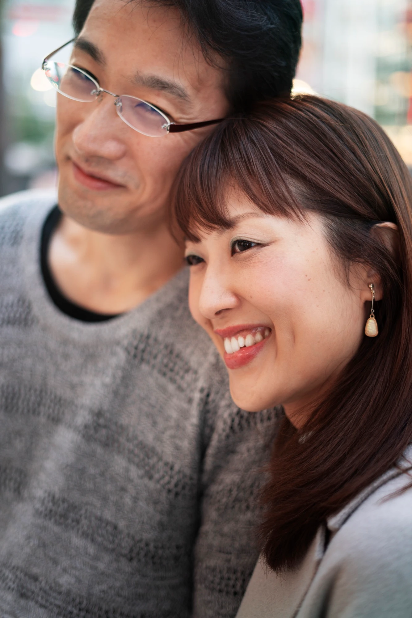 Couple sharing restored, healthy smiles