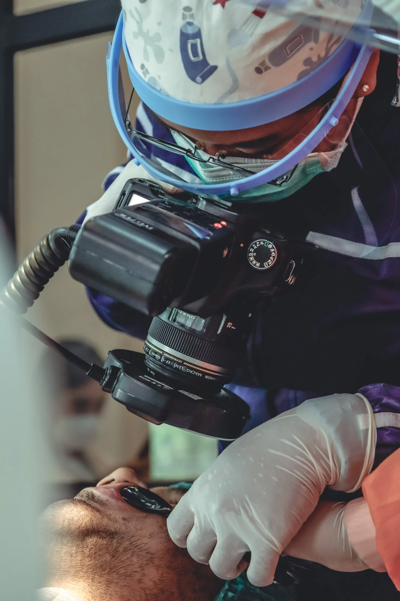 Clinician documenting treatment with a DSLR camera
